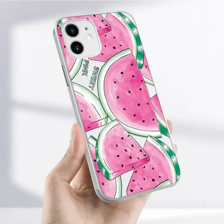 Someone holding a phone case with a watermelon design on it