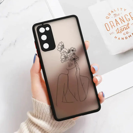 Someone holding a phone case with a drawing of a woman holding a flower