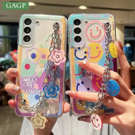 a pair of phone cases with a keychai