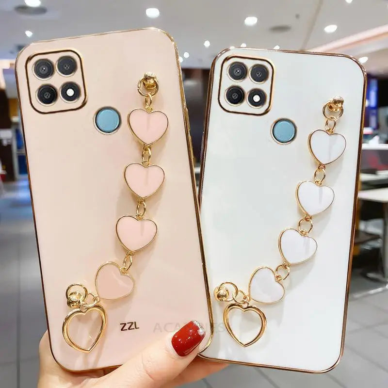 two phone cases with heart charms