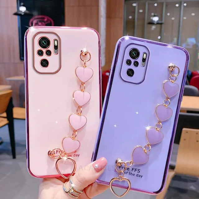 two phone cases with heart charms