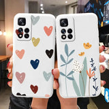 two phone cases with hearts and flowers