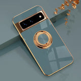 A phone with a gold ring on it