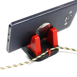 a red phone with a cable connected to it