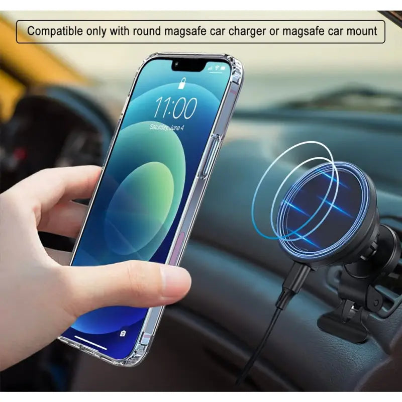 a person holding a phone in their hand while they are using a car charger