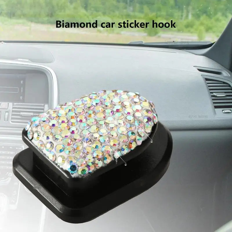a car dashboard with a diamond heart shaped phone holder