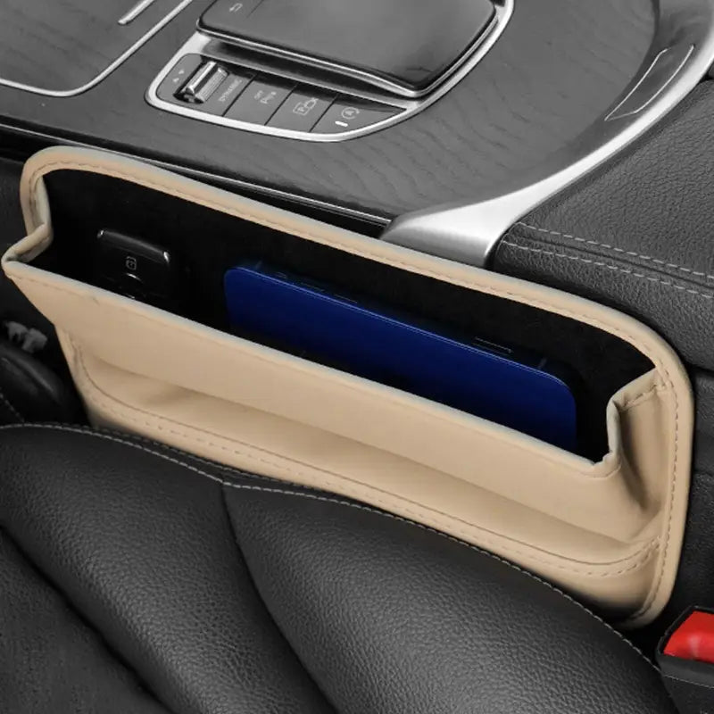 the interior of a car with a phone in it