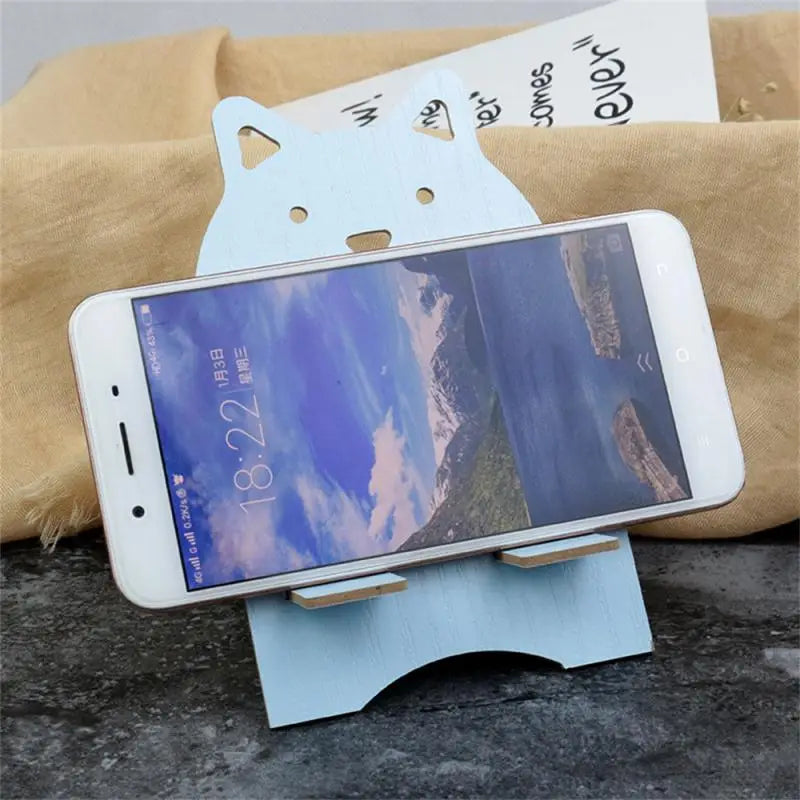 a phone holder with a cat on it