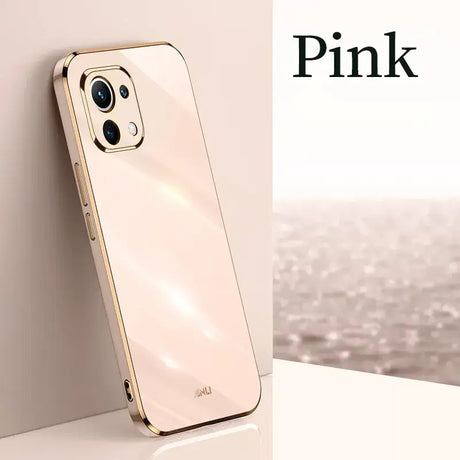 A phone with a pink logo on it