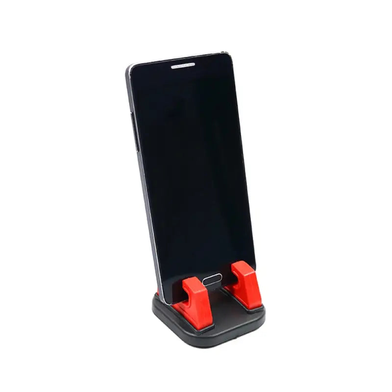 the red phone stand is attached to the phone