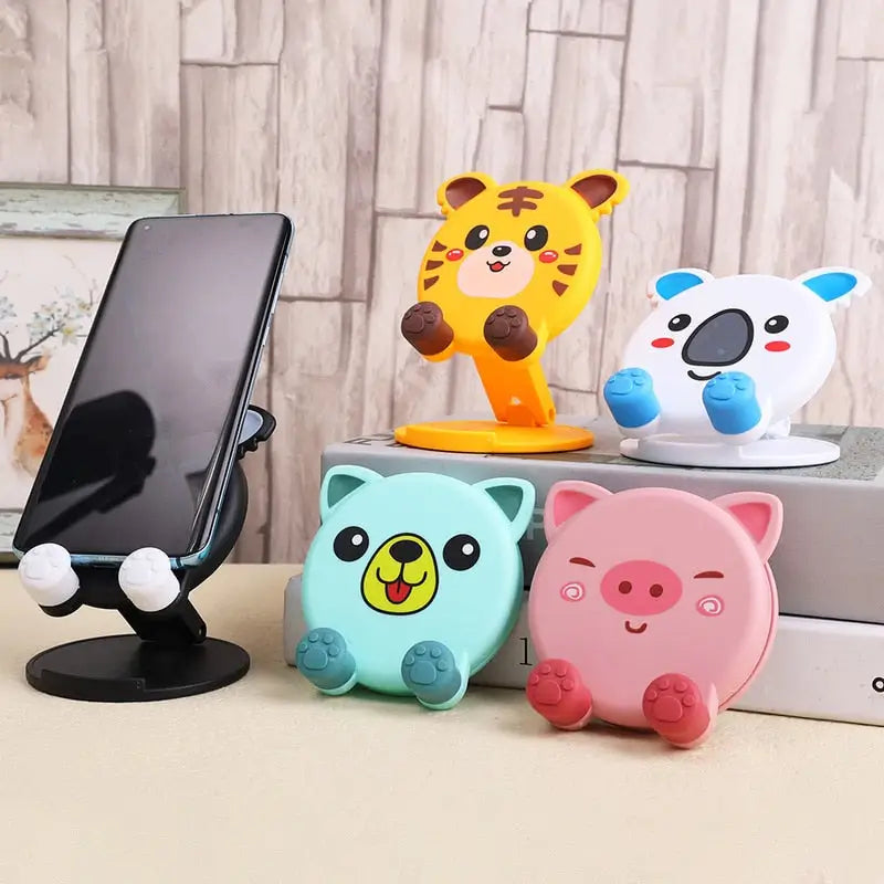 a phone stand with three different animal heads