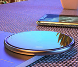 a phone on a table with a phone in the background