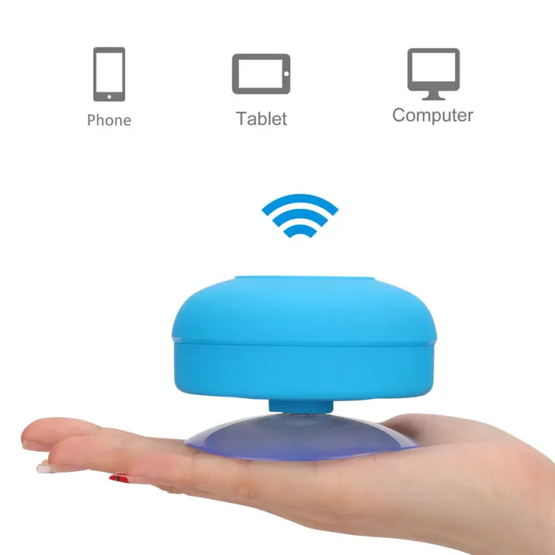 a hand holding a blue portable device