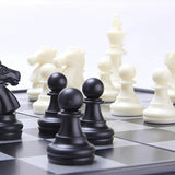 a chess game with a black and white chess set