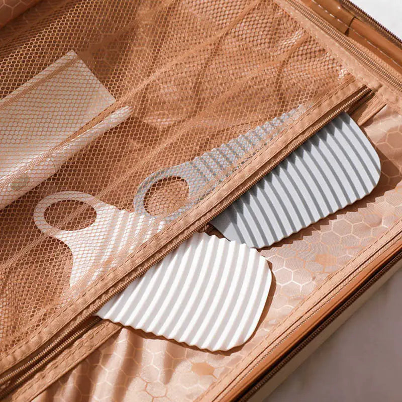 there is a piece of luggage with a comb and a comb in it