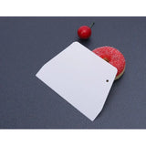 a piece of paper with a red apple on it