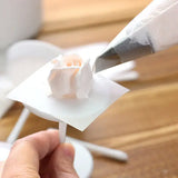 someone cutting a piece of toilet paper