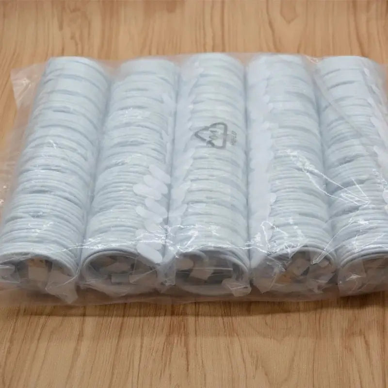 a bag of white plastic wraps on a wooden table
