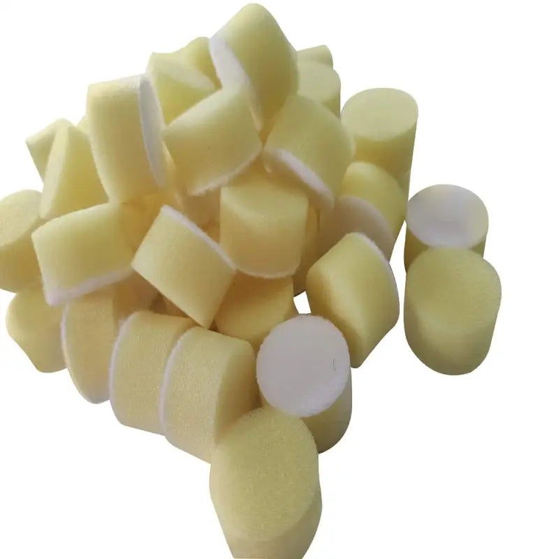 a pile of yellow and white sugar candy