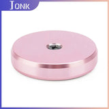 a pink aluminium disc with a hole
