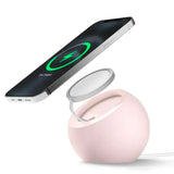 A pink apple with a charging charger attached to it