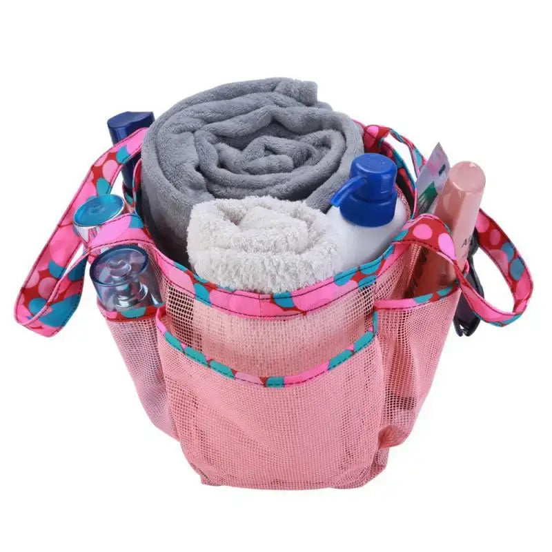 a pink bag with a blanket and a bottle