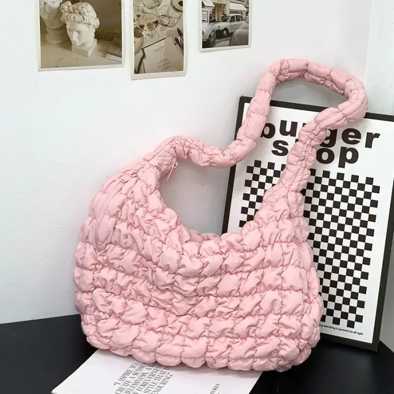 a pink bag sitting on top of a table