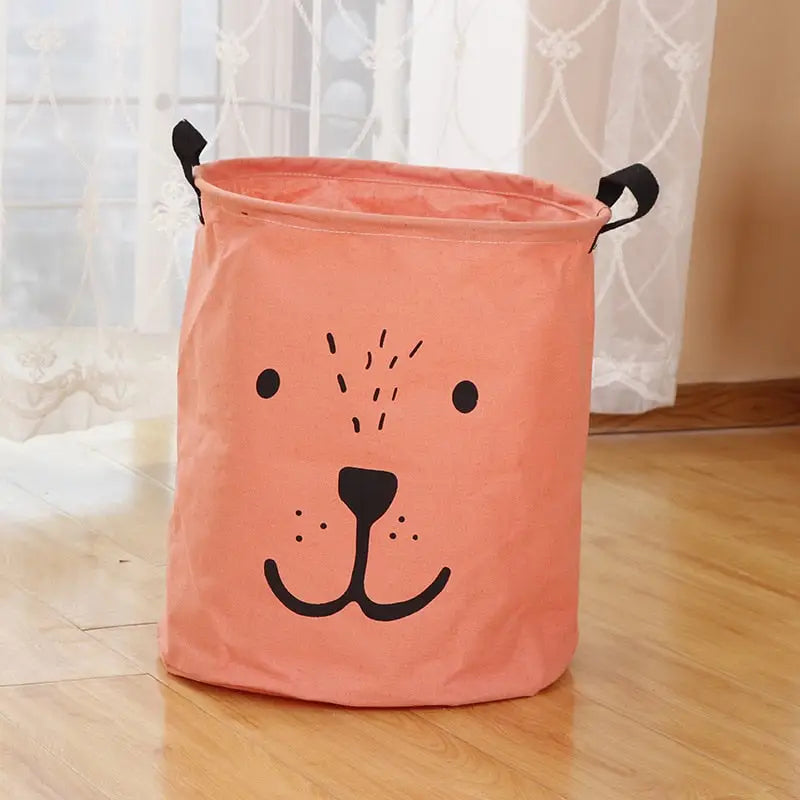 a pink dog toy storage bag on the floor