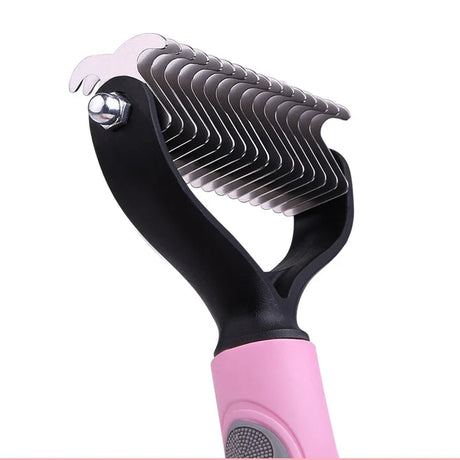 a pink and black hair brush with a white background