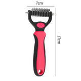 a pink and black hair clipper with a black handle