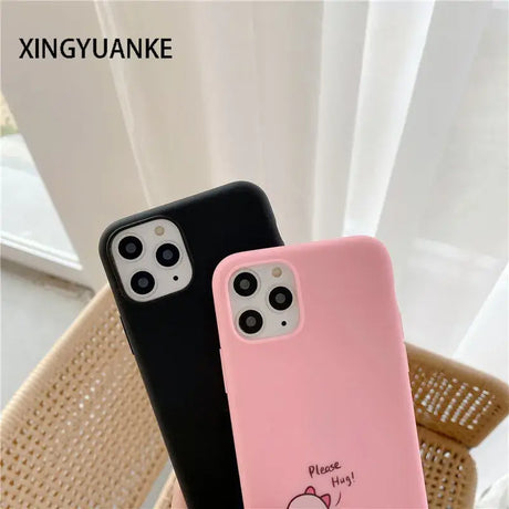 A pink and black iphone case with a heart on it