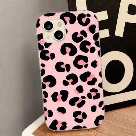 A pink and black leopard print case for the iphone