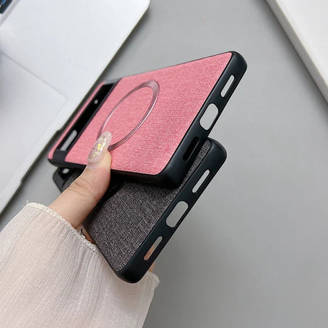 Pink and black smartphone cases with a ring holder attachment.