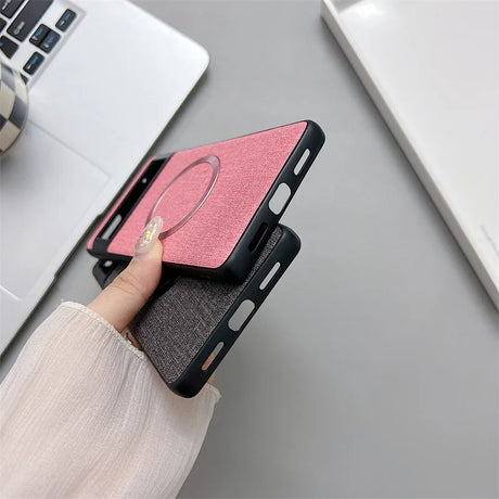 Pink and black smartphone cases with a ring holder attachment.