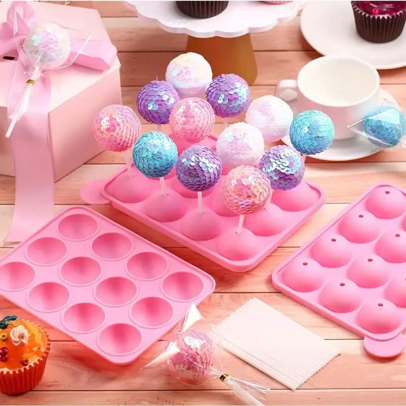a pink cake pan with cupcakes and cupcakes