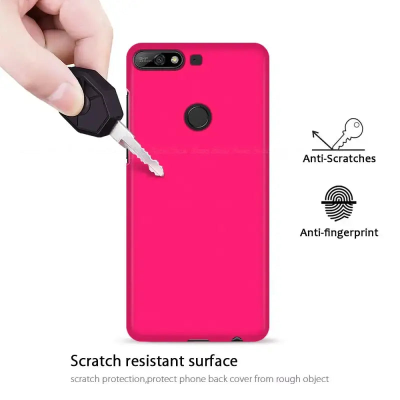 The pink case is being held up by a hand