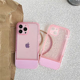 there is a pink case with a pink phone inside of it