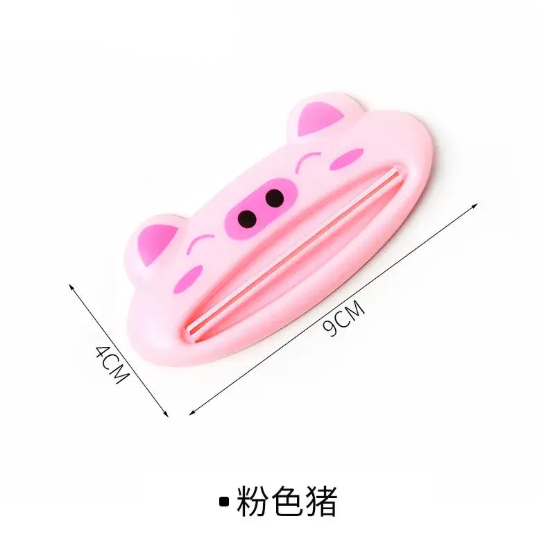 a pink cat shaped hair clip with a black eye