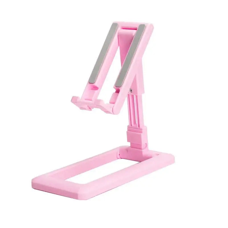 a pink desk lamp with a white base