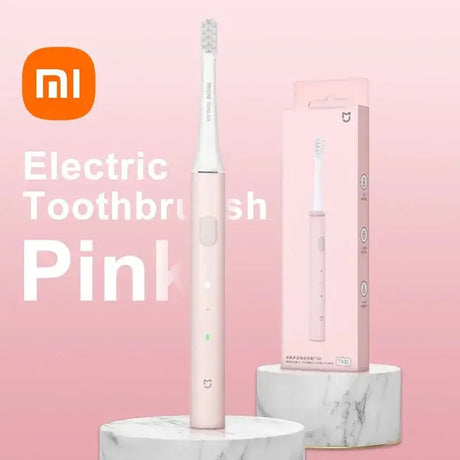 There is a pink electric toothbrush with a pink box