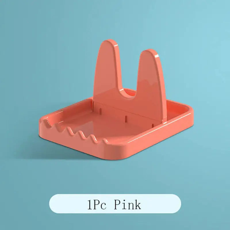 a pink plastic desk organizer with a white background