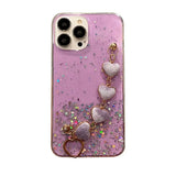 the pink glitter phone case with heart charms