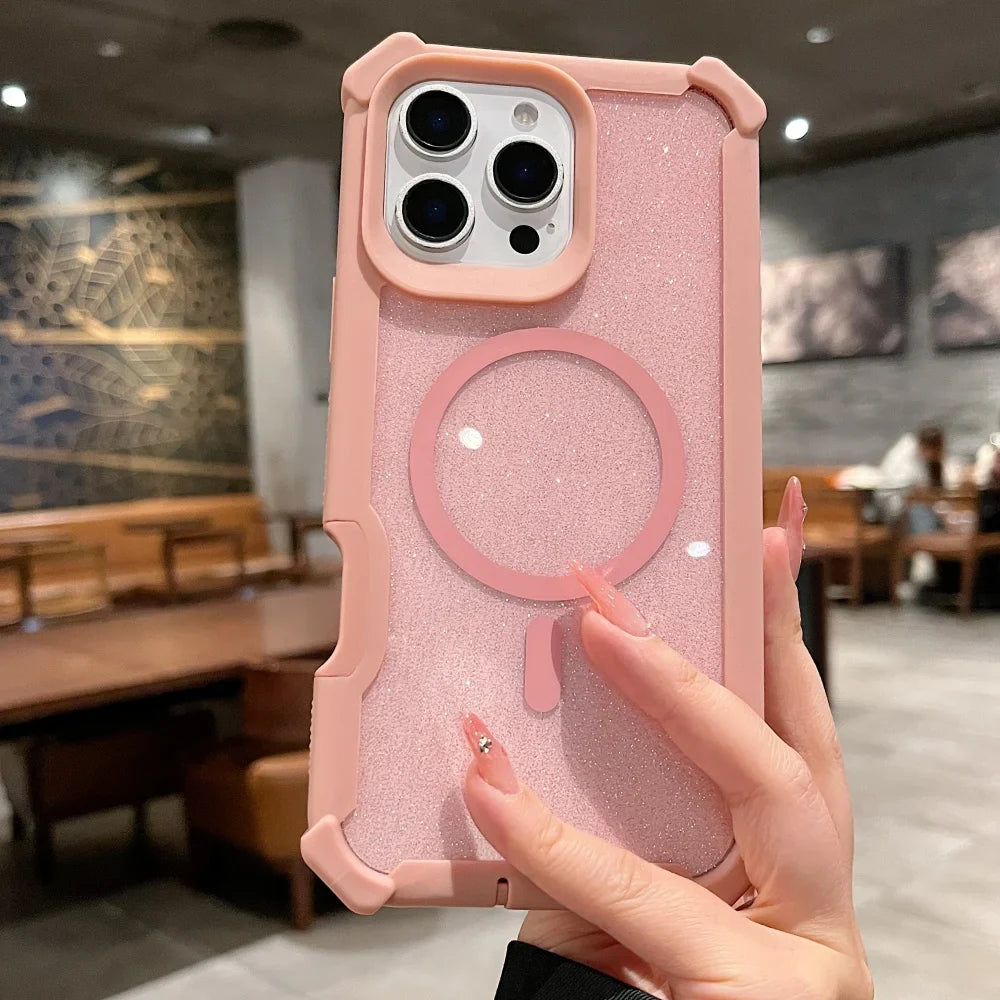 Pink glitter iPhone case with a Magsafe ring and a hand holding it.
