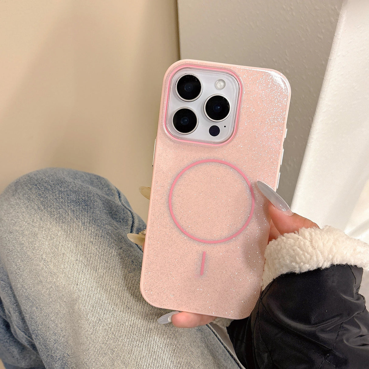Pink glitter slim phone case with magnetic charging circle design shown from the back for wireless charging use