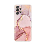 the pink marble phone case is shown with gold foil