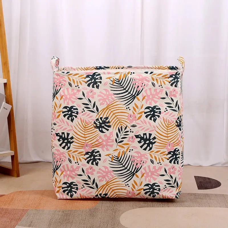 a pink and green floral print cushion on a beige rug
