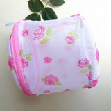 a pink and green rose print mesh bag