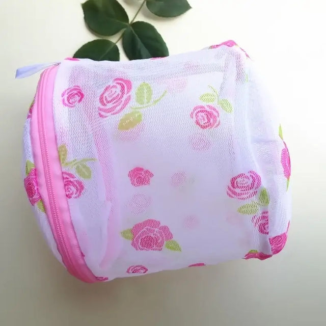 a pink and green rose print mesh bag