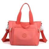 a pink handbag with a zipper closure