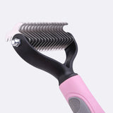 the pink handle of a hair straightener